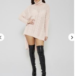 Cable knitted dip hem dress